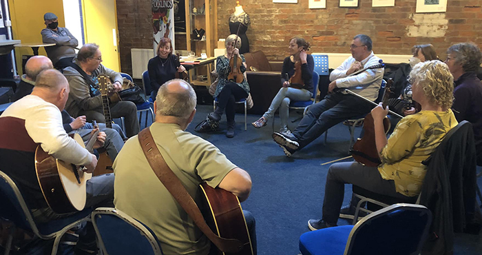 folk workshop with guitars and fiddle
